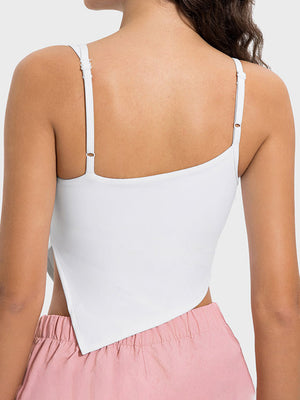 White asymmetric cutout cami tank top with adjustable straps and a unique hem