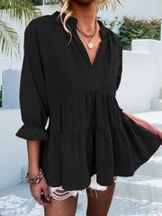 Black tiered linen blouse with ruffled sleeves and V-neck