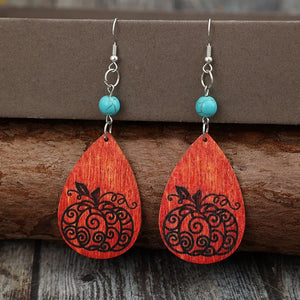 Autumnal pumpkin wood dangle earrings with turquoise beads and silver hooks.