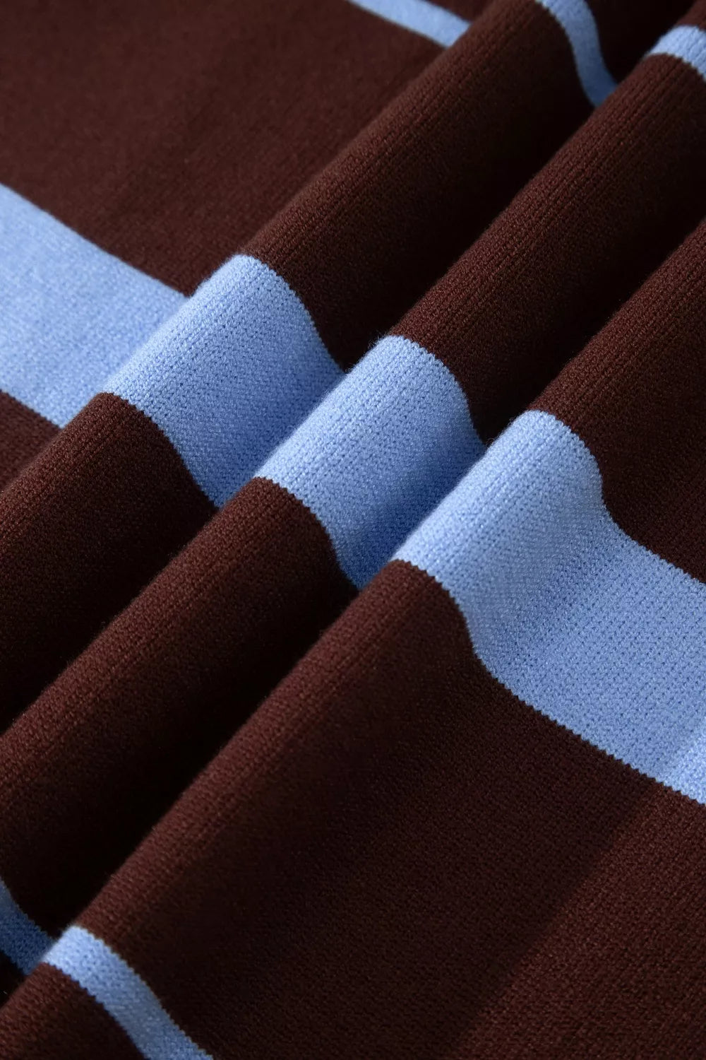 Chic striped knit sweater in brown and light blue with ribbed details.