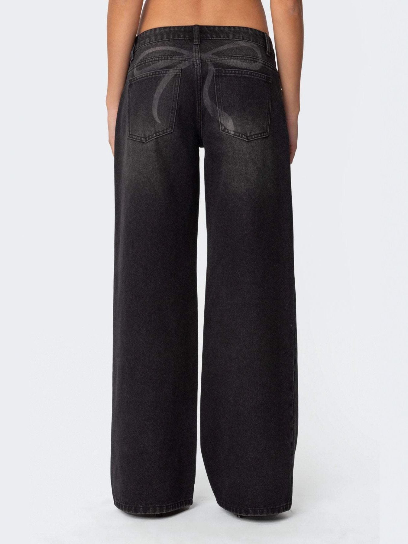 Black wide leg denim jeans with a subtle bow design on the back pockets.