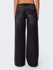 Black wide leg denim jeans with a subtle bow design on the back pockets.