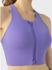Purple zip-front racerback sports bra with a full zipper closure.