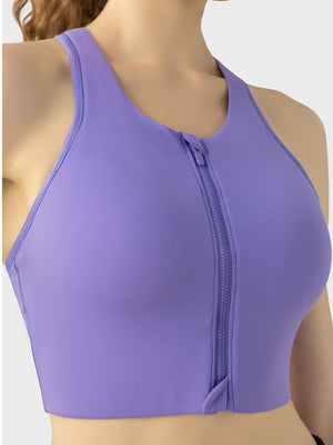 Purple zip-front racerback sports bra with a full zipper closure.