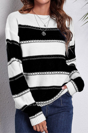 Black and white striped acrylic sweater with perforated detail and off-shoulder neckline.