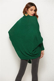 Textured cocoon knit cardigan in dark green with batwing sleeves and a cowl neck.