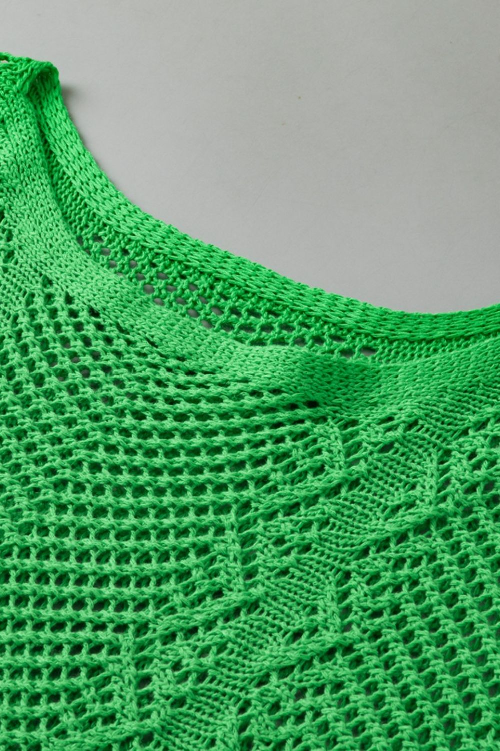 Green open-knit chevron sleeve top with a crew neck and textured detail.