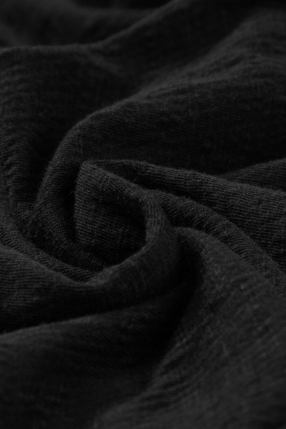 Black ribbed jumpsuit with textured fabric detail