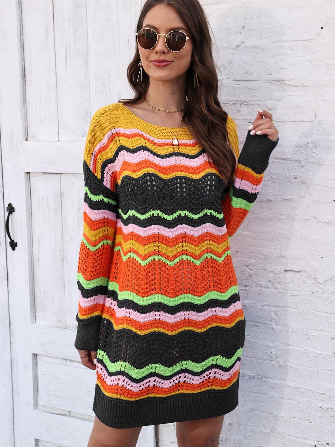 Chevron stripe knit mini dress with crew neck and long sleeves in a multicolor pattern.