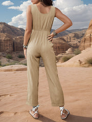 Khaki linen blend jumpsuit with elastic waist and wide legs.