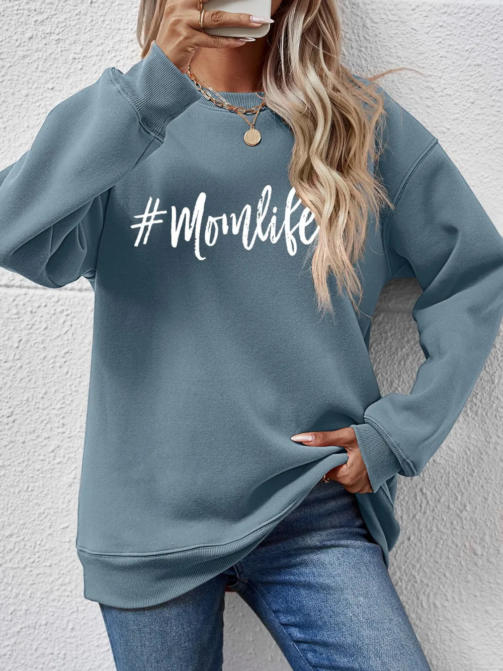 Momlife crewneck sweatshirt in Misty Blue with white graphic text, crew neck, long sleeves, and relaxed fit.