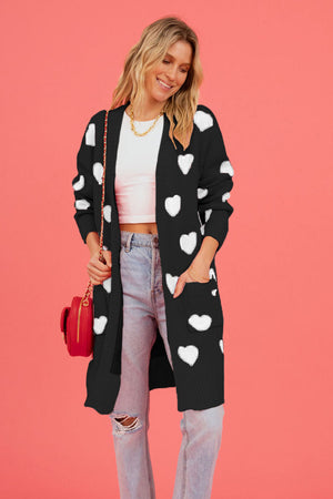 Black acrylic longline cardigan with white heart motif and pockets