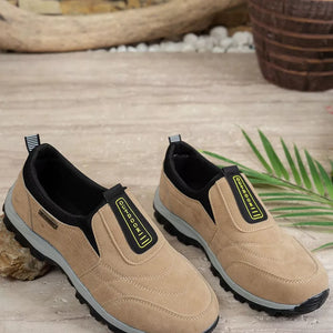 Khaki suede-like round toe slip-on sneakers with black trim and "OUTDOOR" detail.