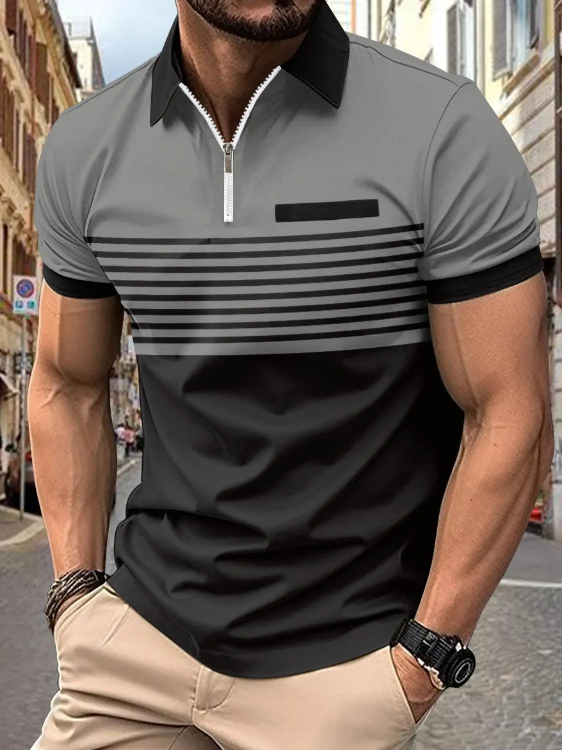 Colorblock zip polo shirt in gray and black with horizontal stripes and a chest pocket.