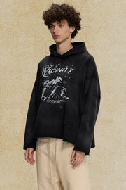 Black oversized distressed graphic hoodie with ripped details and a crew neck.