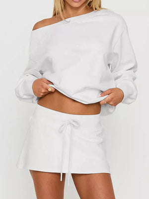 White cropped boat neck sweatshirt and mini skirt with drawstring
