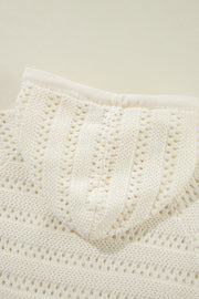 Openwork knit hoodie in beige with a drawstring detail and textured stitch pattern.