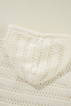 Openwork knit hoodie in beige with a drawstring detail and textured stitch pattern.