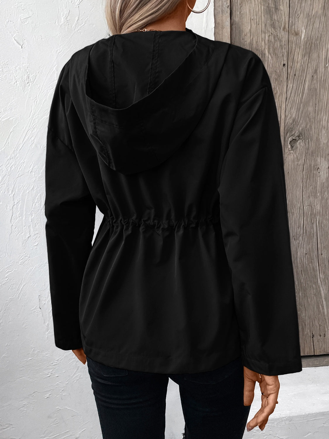 Black hooded utility jacket with cinched waistline detail
