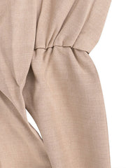 Beige halter neck wide leg jumpsuit with drawstring waist detail