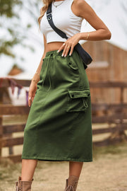 Army green midi skirt with drawstring waist and cargo pockets.