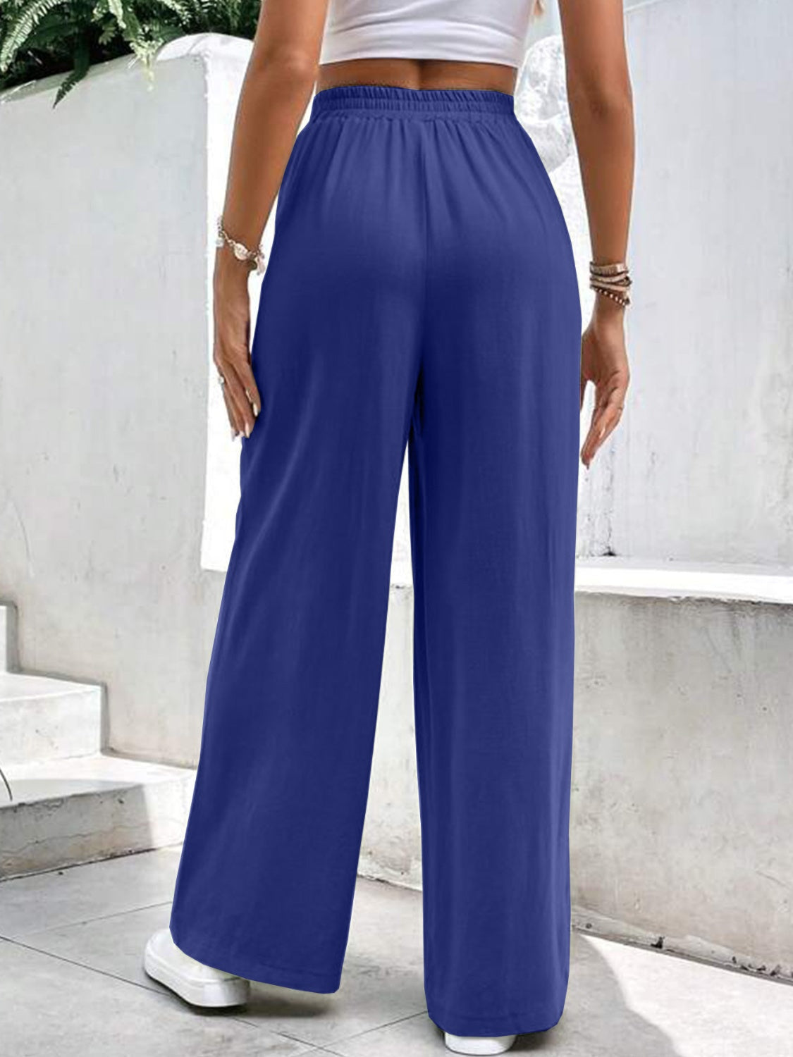 Royal blue relaxed drape palazzo trousers with pockets, wide leg.