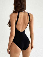 Black halterneck mesh swimsuit with a low back and keyhole detail.