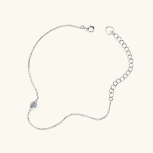 Silver moissanite solitaire chain bracelet with lobster clasp and extender chain.