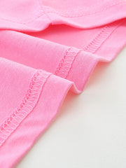 Pink cotton t-shirt detail showing double-stitched hem and seams.