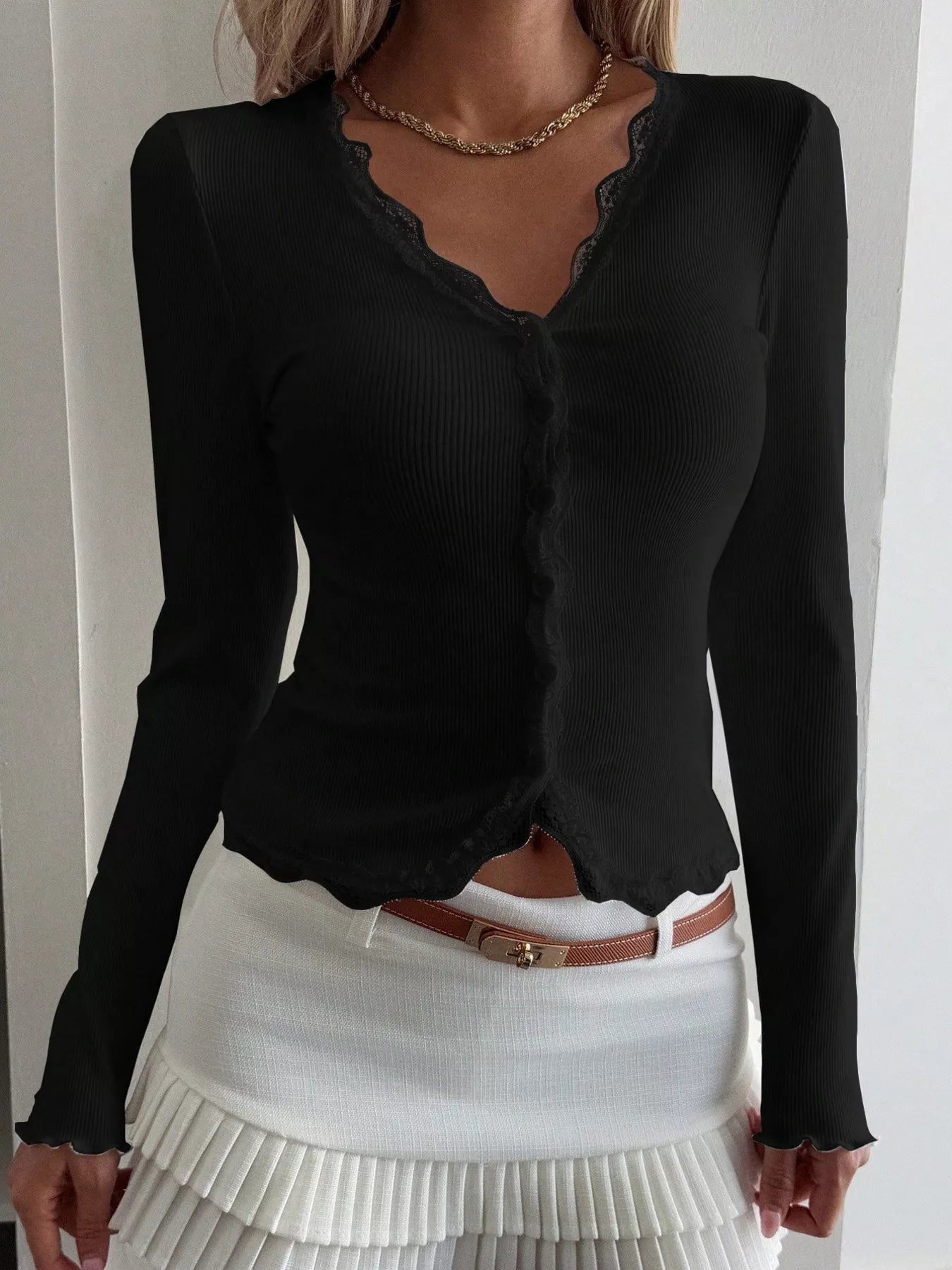 Black ribbed long sleeve top with lace trim neckline and button front
