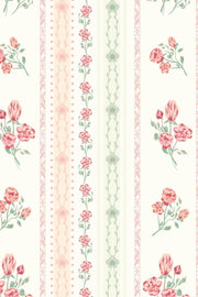 Pajama set in ivory with a cherry blossom print and striped accents.