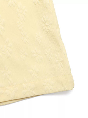 Chic Tie Strap Wide-leg Jumpsuit in light yellow with subtle floral texture