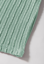 Textured cable knit sweater top in Gum Leaf green with flutter sleeves.