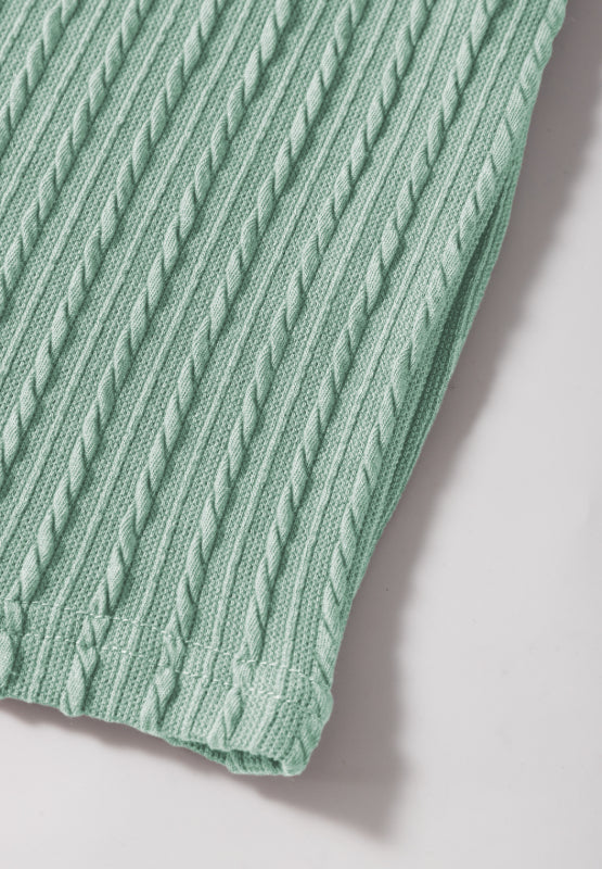 Textured cable knit sweater top in Gum Leaf green with flutter sleeves.