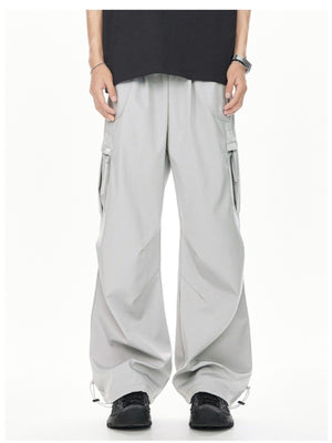 Men's light gray relaxed fit cargo sweatpants with adjustable drawstring cuffs and multiple pockets.