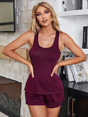 Burgundy loungewear set with contrast trim tank top and shorts.