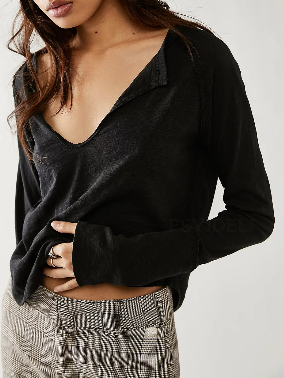 Black long sleeve tee with distressed slouchy plunge neckline and raw edge detail.