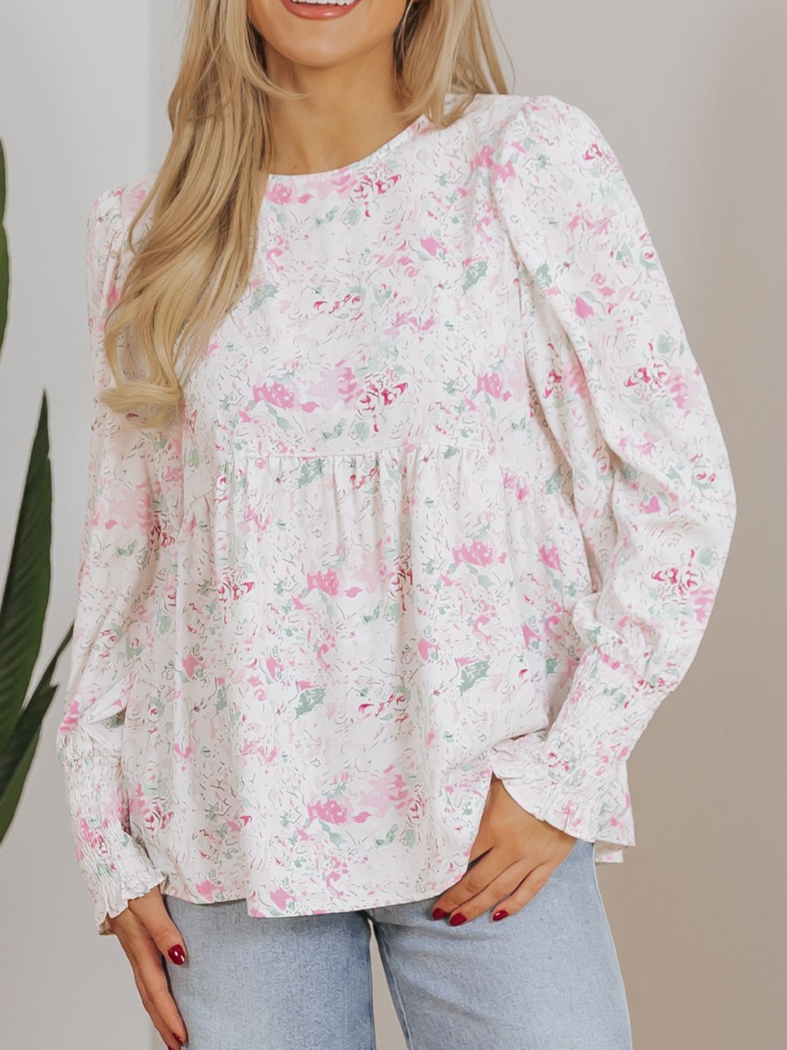 Blush pink floral print blouse with smocked waist and cuffs
