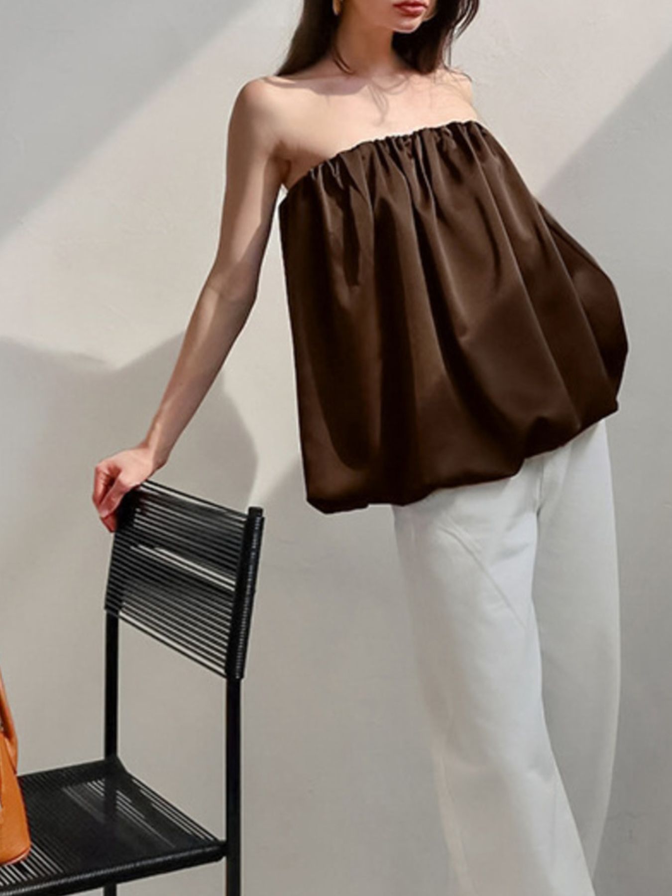 Dark brown strapless bubble hem top with gathered neckline.