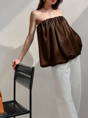 Dark brown strapless bubble hem top with gathered neckline.