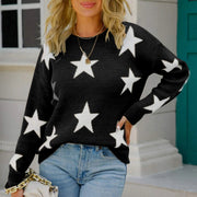 Black acrylic crewneck sweater with white stars, long sleeves, ribbed cuffs and hem.