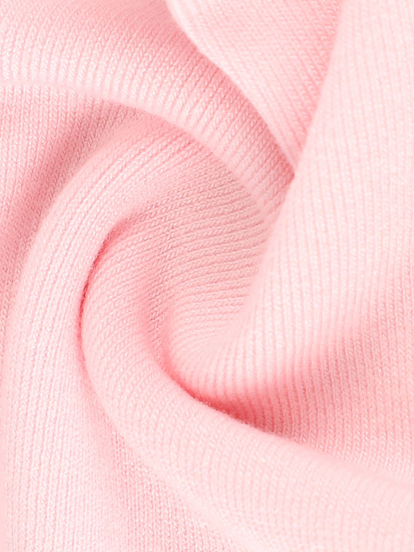Pink polyester t-shirt with tie-front detail and puff sleeves, showing fabric texture.