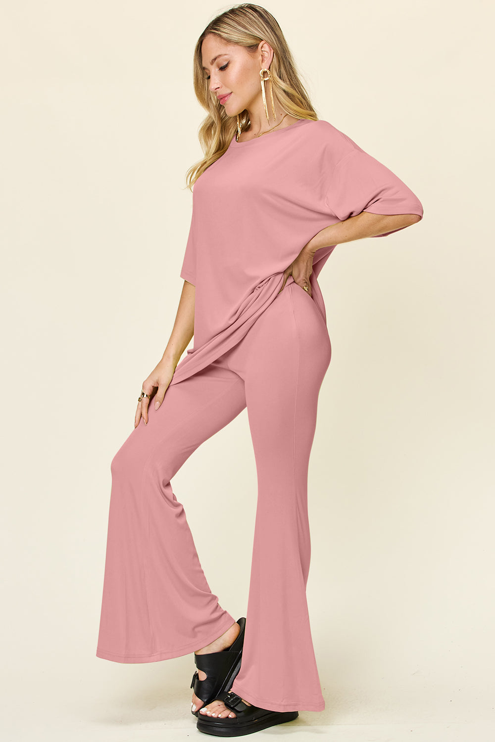 Dusty Pink oversized tee and flare leg pants set with a relaxed fit.