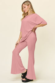 Dusty Pink oversized tee and flare leg pants set with a relaxed fit.