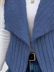 Blue fleece vest with open front and shawl collar, textured material.