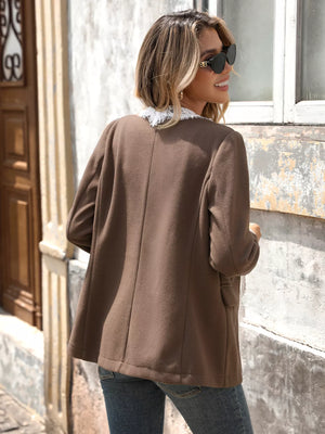 Brown button-up blazer with white lace trim collar and lapels, classic style.