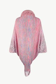 Textured knit cape in dusty pink with faux fur collar and fringe detail