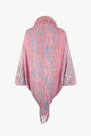 Textured knit cape in dusty pink with faux fur collar and fringe detail