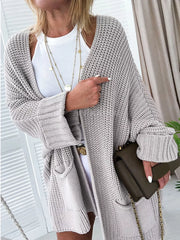 Cozy open front cardigan in light gray acrylic knit with pockets and a relaxed fit.