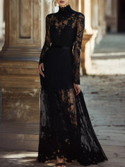 Black lace high neck maxi dress with long sleeves and a sheer hem.
